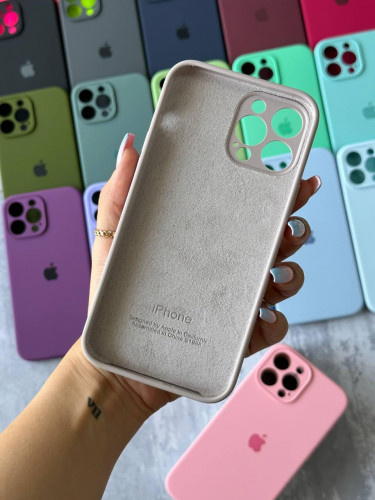 The original silicone case inside the fur of the iPhone 15
