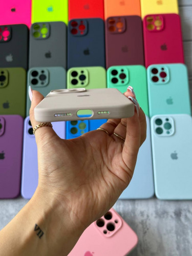 The original silicone case inside the fur of the iPhone 15